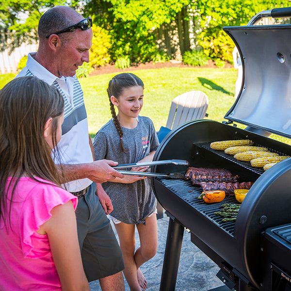 Broil King Regal Pellet Smoker and Grill Kids and Dad