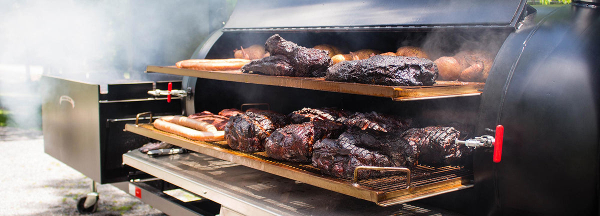 Meadow Creek TS250 offset tank smoker loaded with brisket, ribs, chicken and sausage