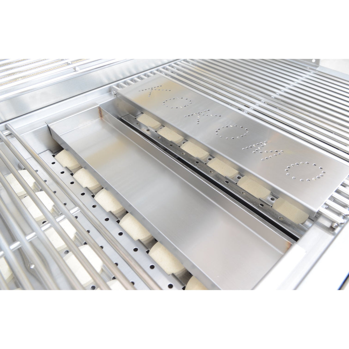 Kokomo smoker chip box under the cooking grids of a Kokomo grill
