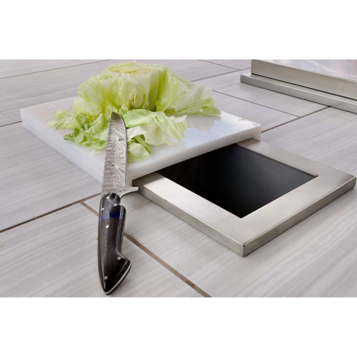 Prepping food on the Kokomo trash chute cutting board