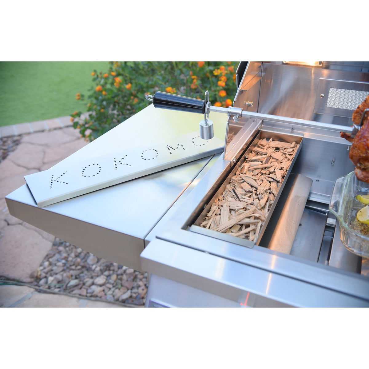 Kokomo smoker chip box with wood chips in use