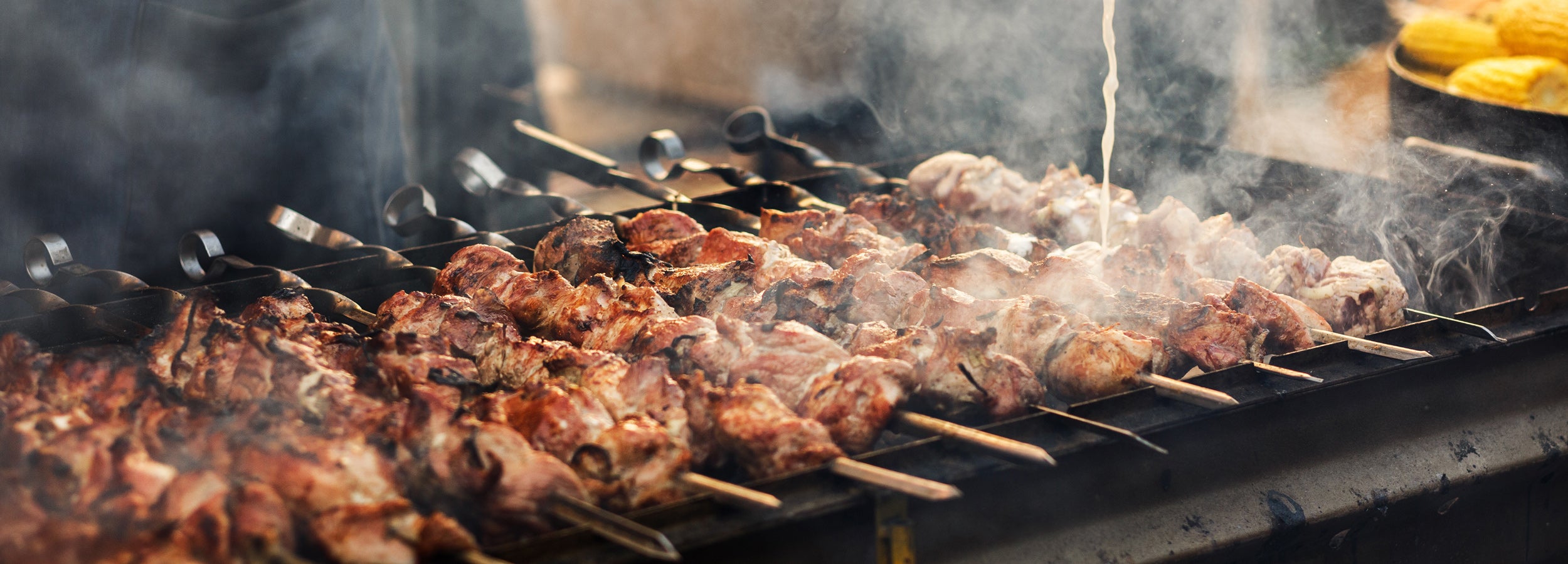 Premium outdoor cooking equipment including grills, smokers, pizza ovens, and BBQ accessories